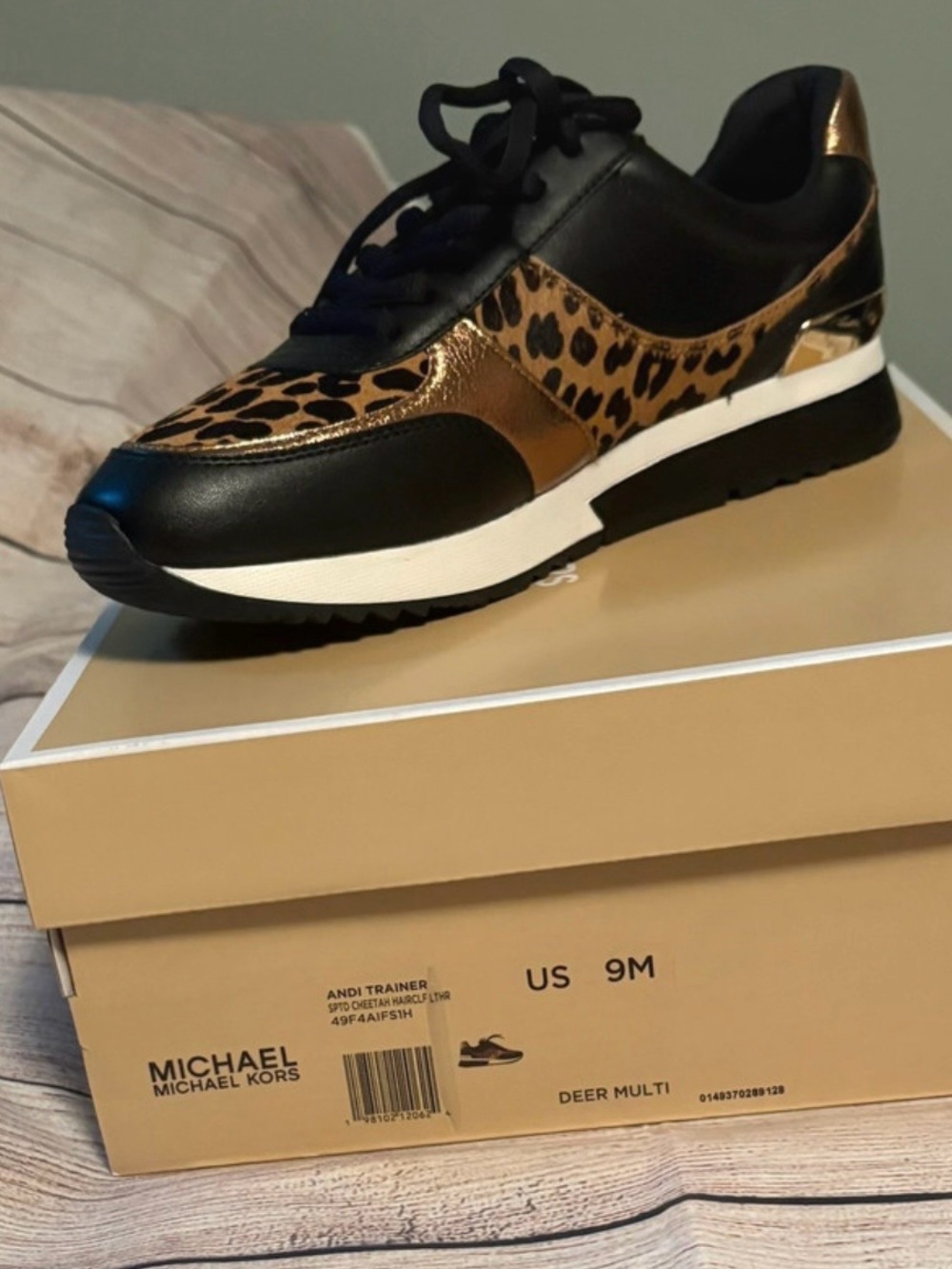 Michael Kors Black sneaker with gold and leopard print accents